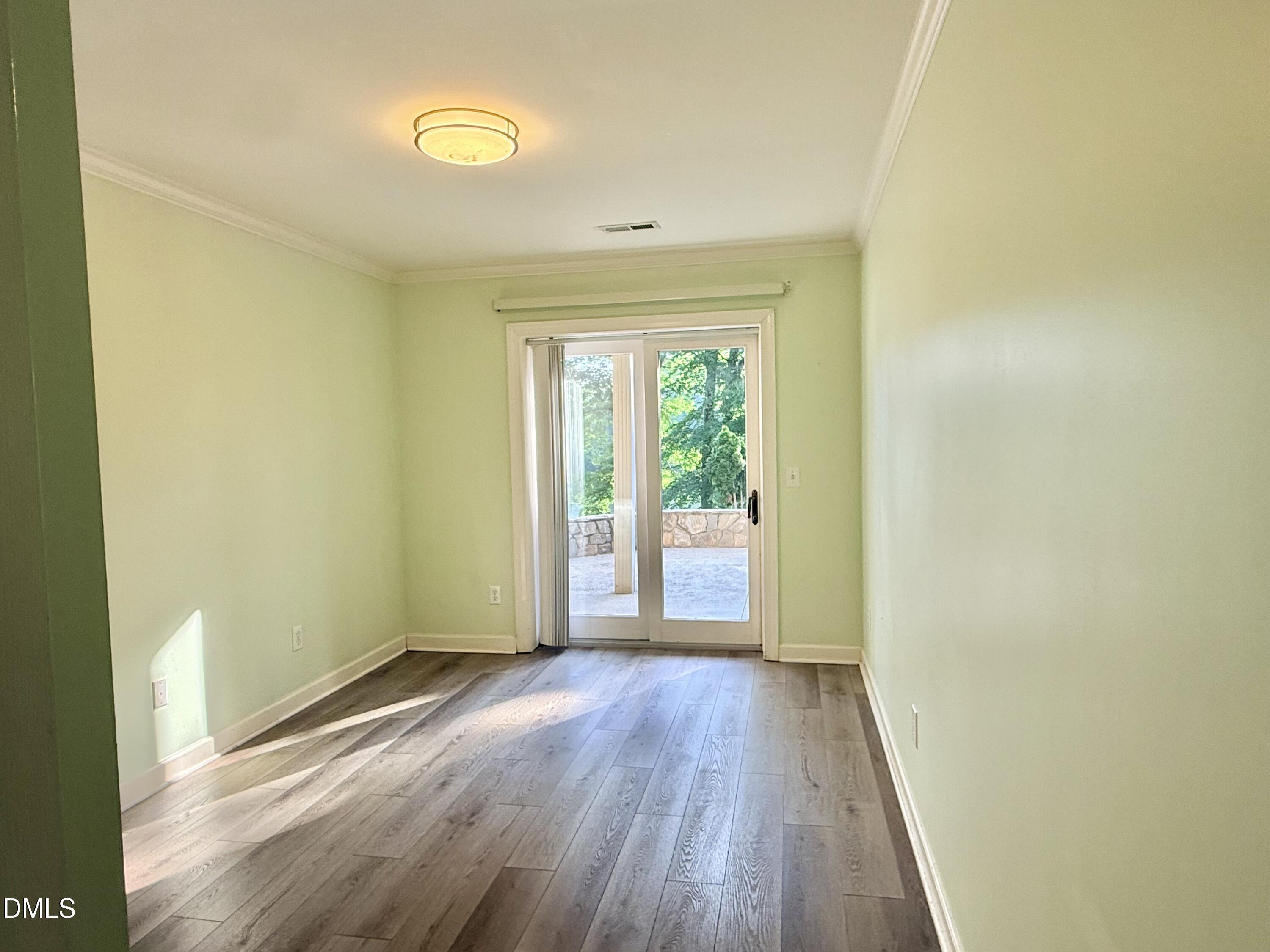 81 Beaver Crossing Road Roxboro, NC 27574 - Photo 37 of 80 a view of a room with wooden floor and window