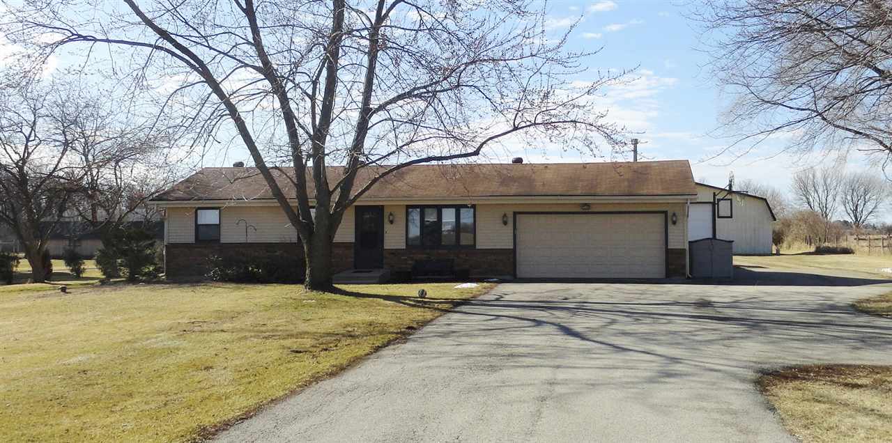 5375 Baxter Road Rockford, IL 61109 - Photo 1 of 14 a view of a house with snow on the side of the road