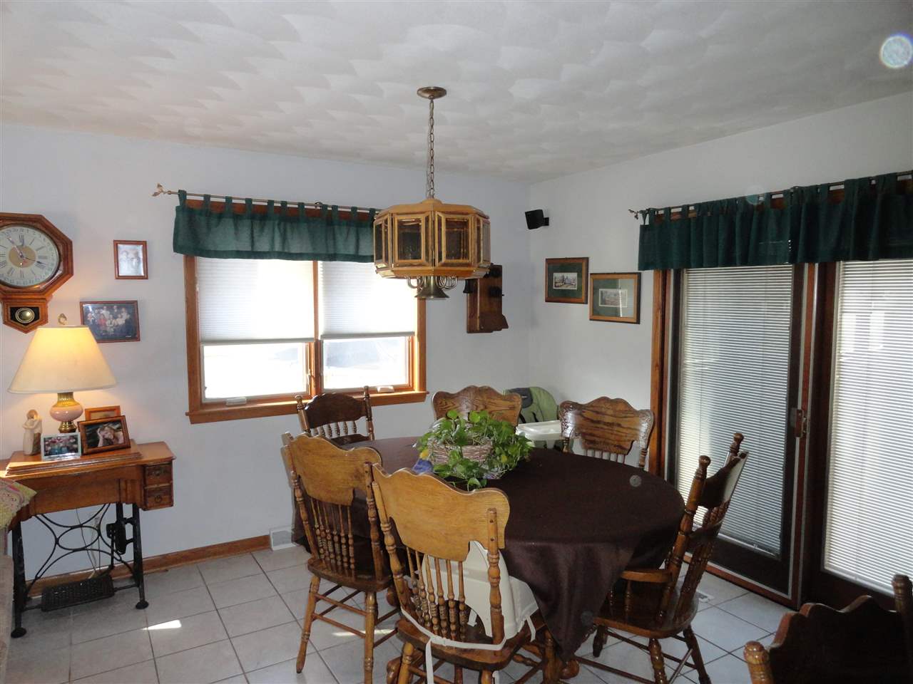 5375 Baxter Road Rockford, IL 61109 - Photo 2 of 14 a view of a dining room with furniture window and wooden floor