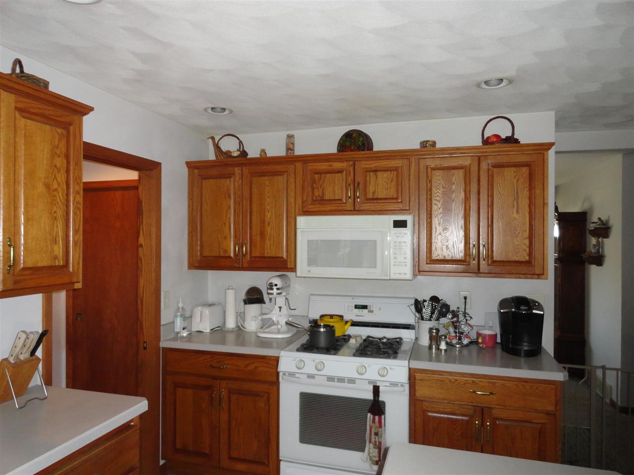 5375 Baxter Road Rockford, IL 61109 - Photo 3 of 14 a kitchen with stainless steel appliances granite countertop a sink stove and cabinets
