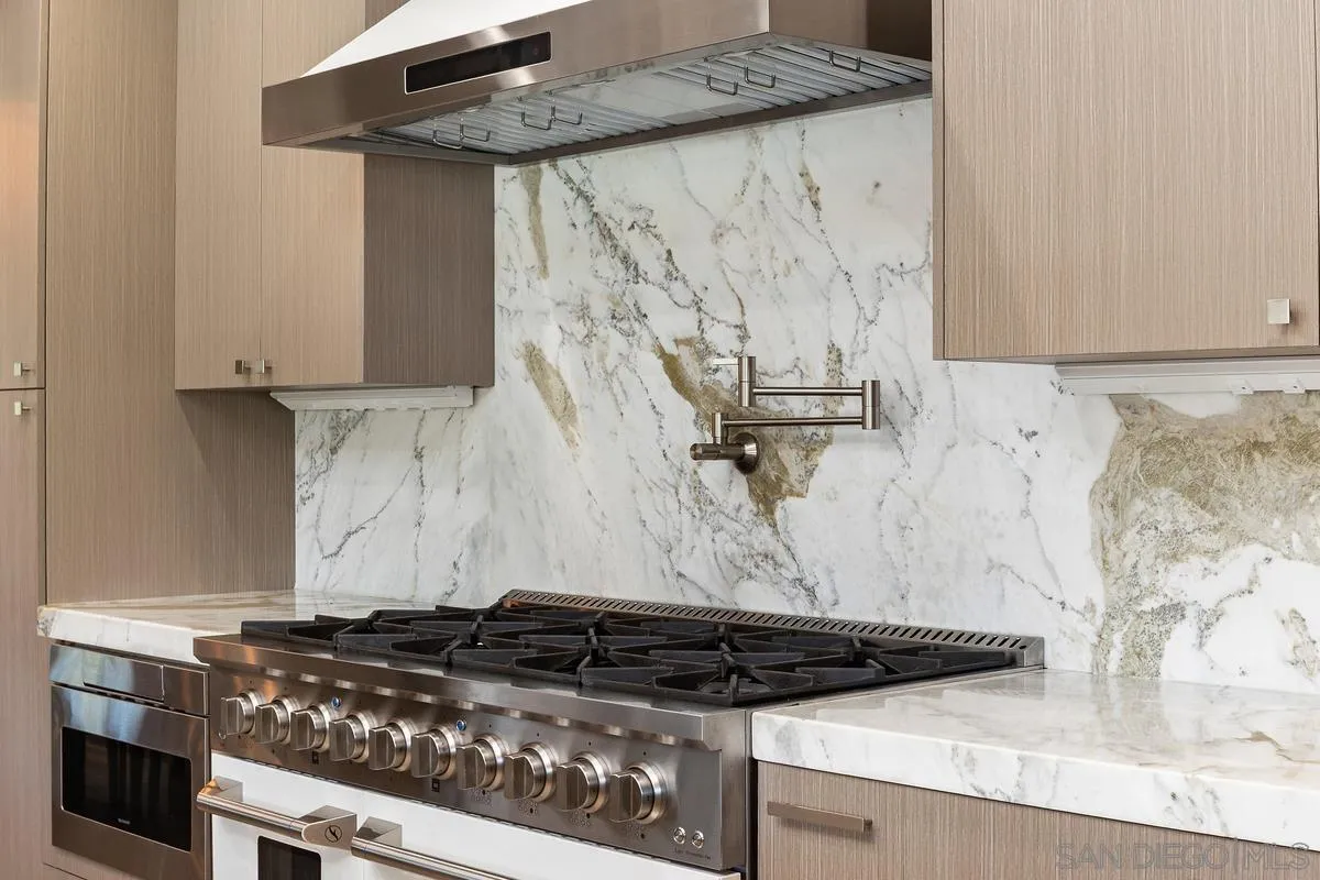 3064 Live Oak Park Road Fallbrook, CA 92028 - Photo 14 of 74 a stove top oven sitting inside of a kitchen