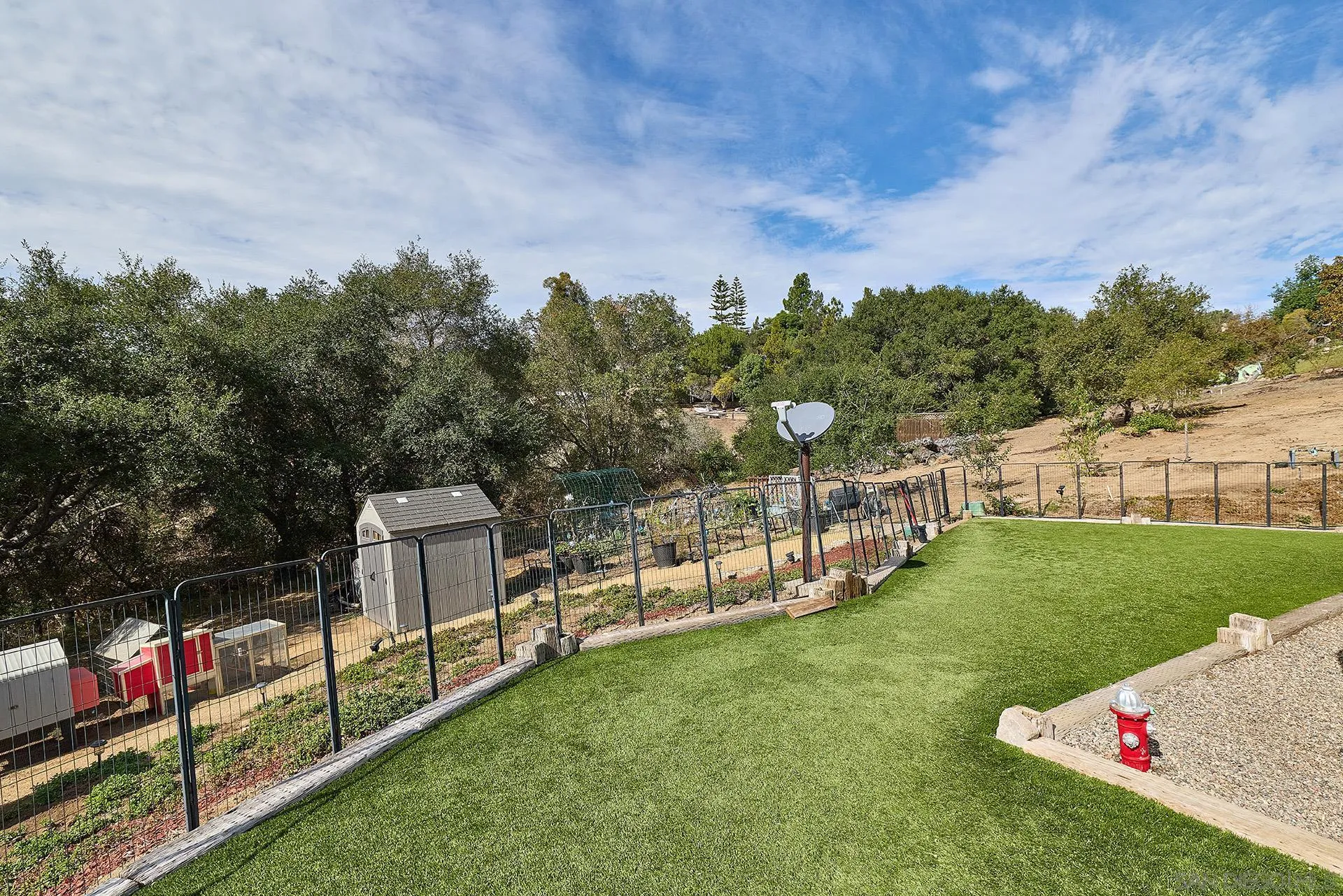 3064 Live Oak Park Road Fallbrook, CA 92028 - Photo 52 of 74 a view of a chair and table on the green field