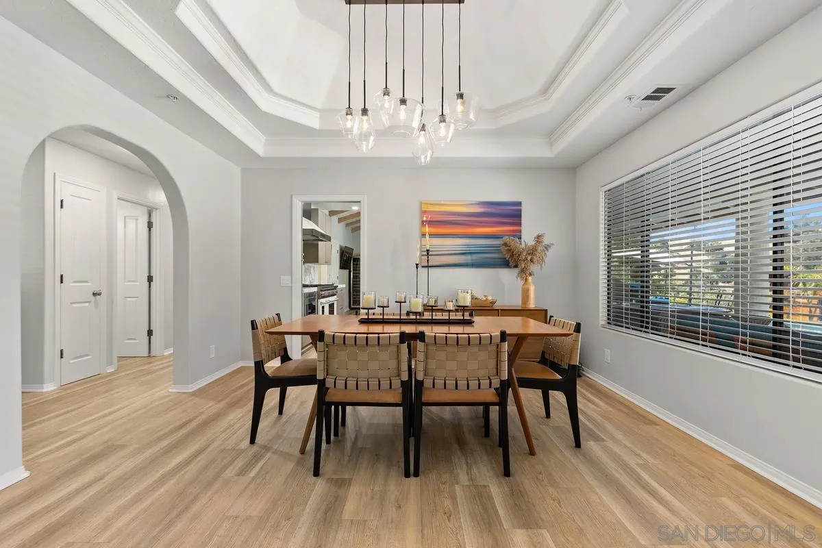 3064 Live Oak Park Road Fallbrook, CA 92028 - Photo 8 of 74 a view of a dining room with furniture window and wooden floor