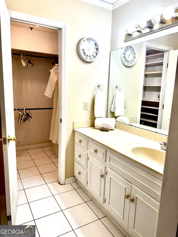 a bathroom with a sink a mirror and a shower