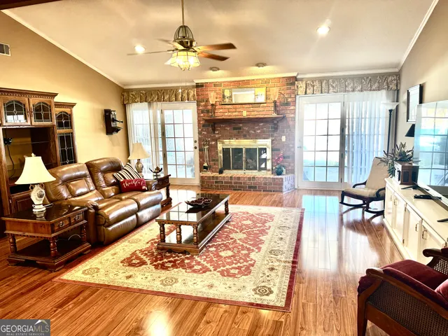 a living room with furniture or couch and a dining table