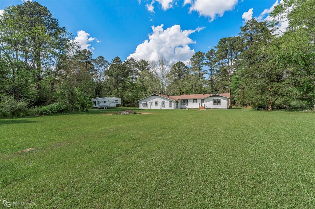 5725 Harper Road Keithville, LA 71047 - Photo 8 of 35 a view of a house with a big yard
