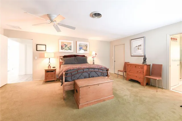 a living room with furniture and a lamp