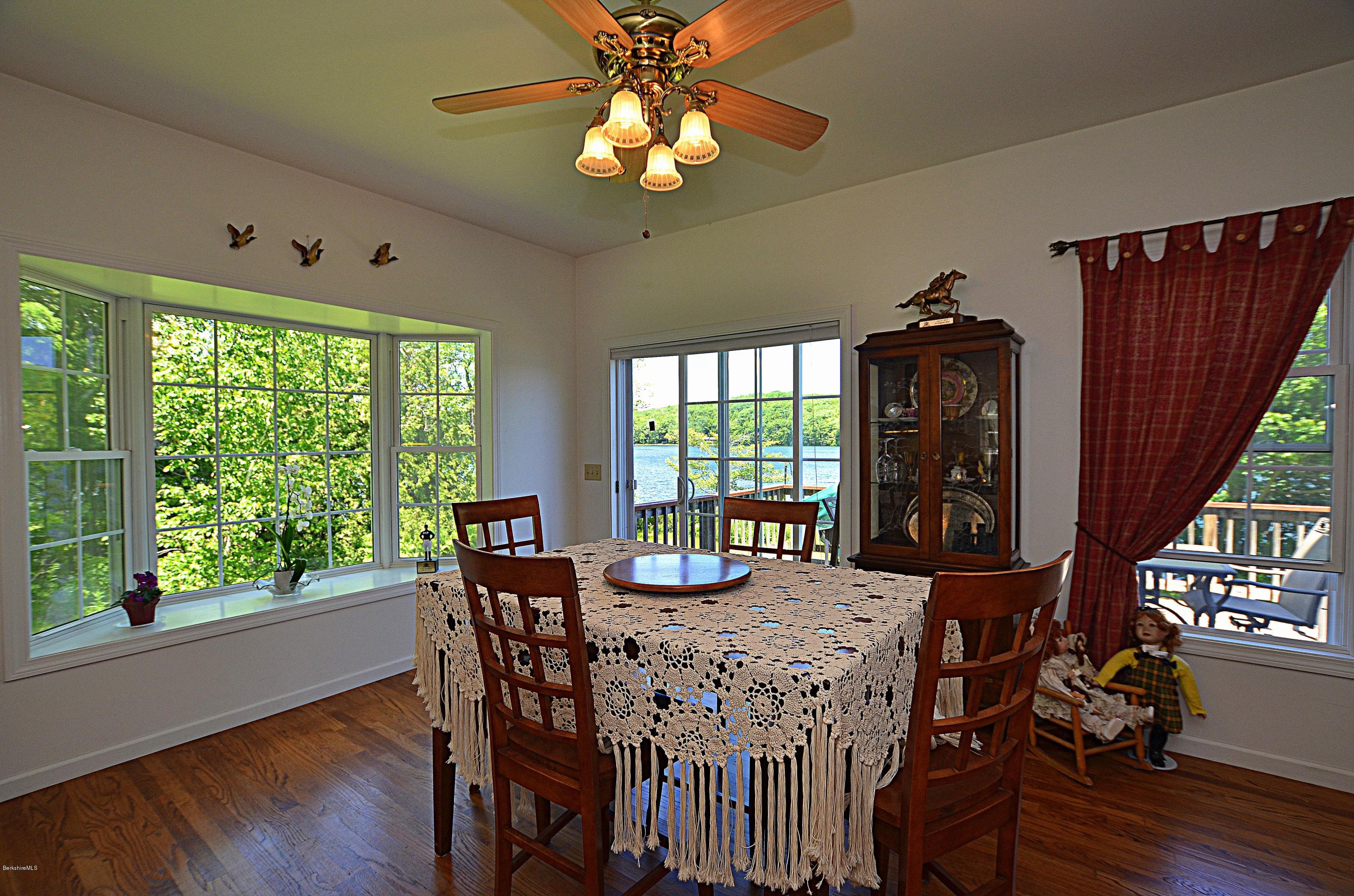 1381 East Otis Road Otis, MA 01029 - Photo 11 of 48 a view of a dining room with furniture window and wooden floor