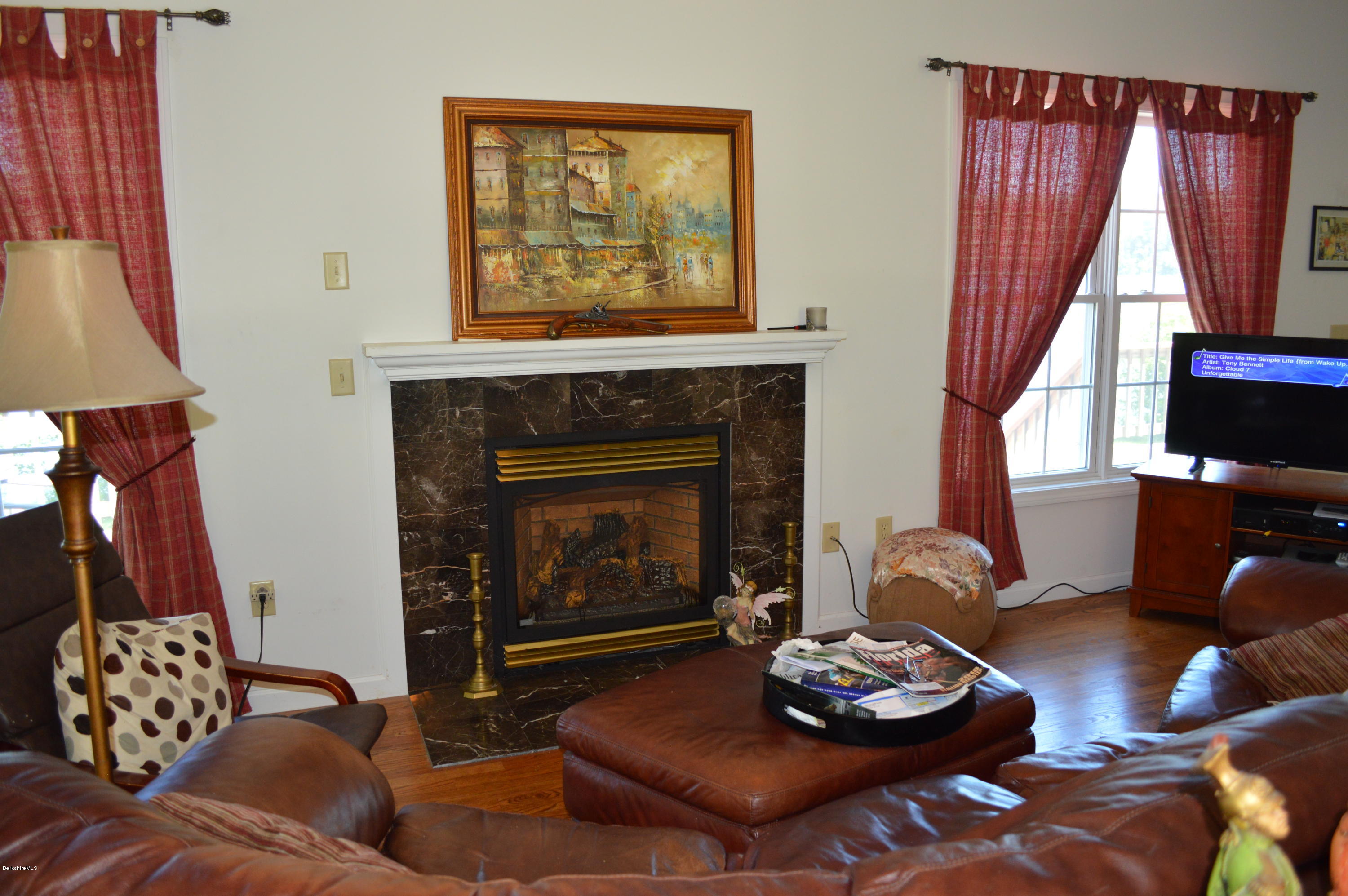 1381 East Otis Road Otis, MA 01029 - Photo 13 of 48 a living room with furniture and a fireplace
