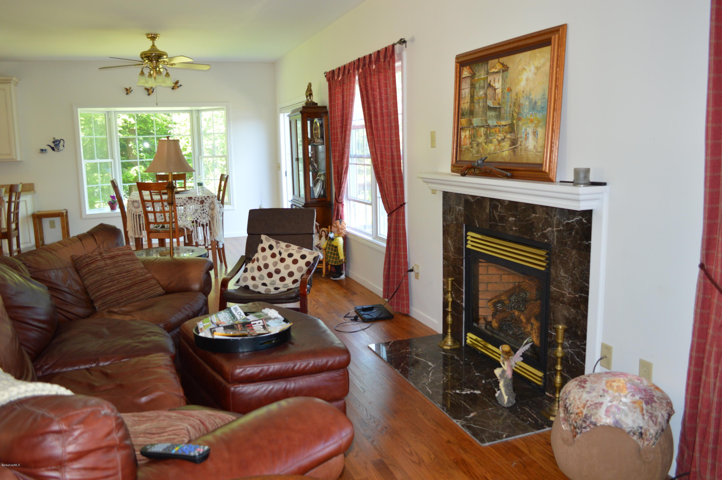 1381 East Otis Road Otis, MA 01029 - Photo 14 of 48 a living room with furniture and a fireplace
