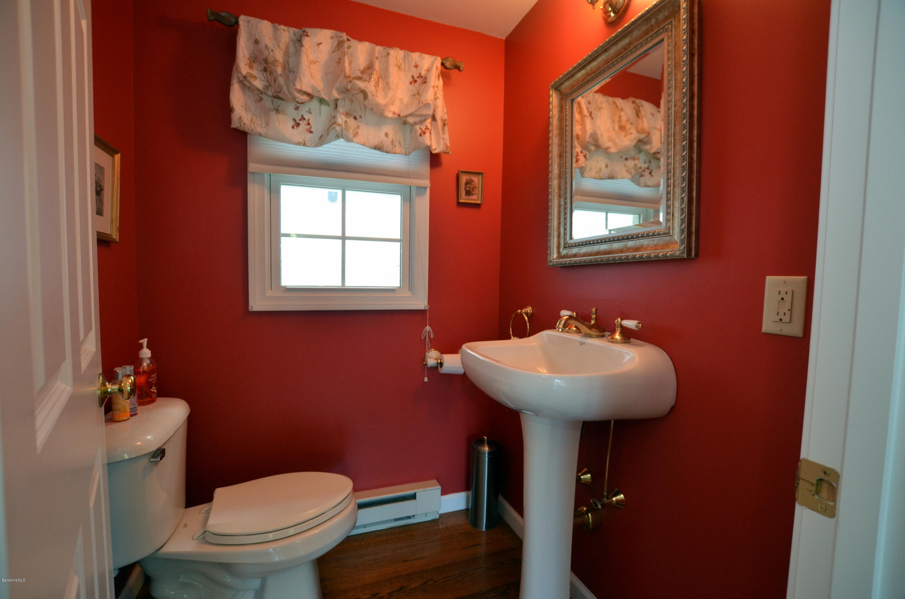 1381 East Otis Road Otis, MA 01029 - Photo 16 of 48 a bathroom with a sink toilet and mirror