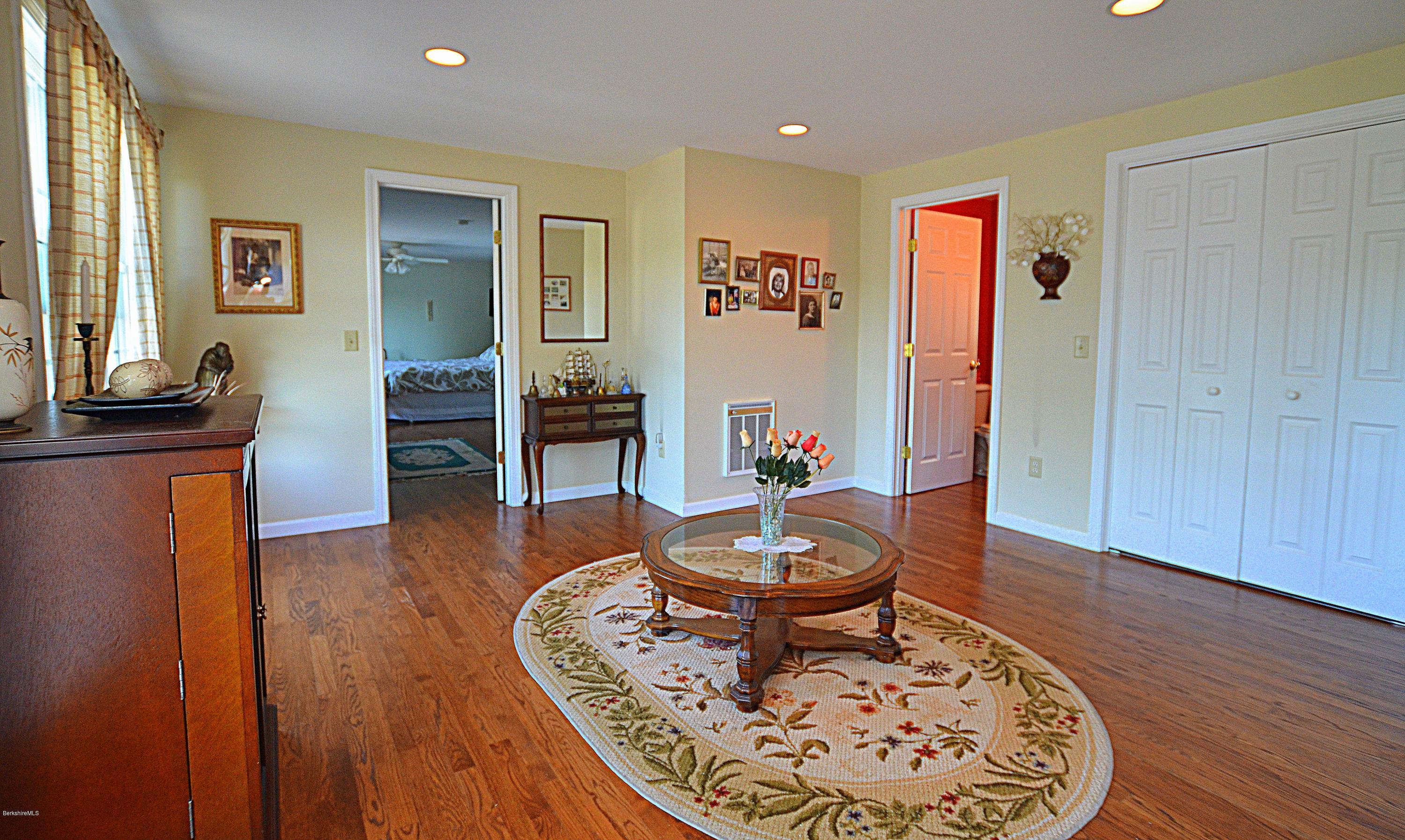 1381 East Otis Road Otis, MA 01029 - Photo 18 of 48 a living room with furniture and a wooden floor