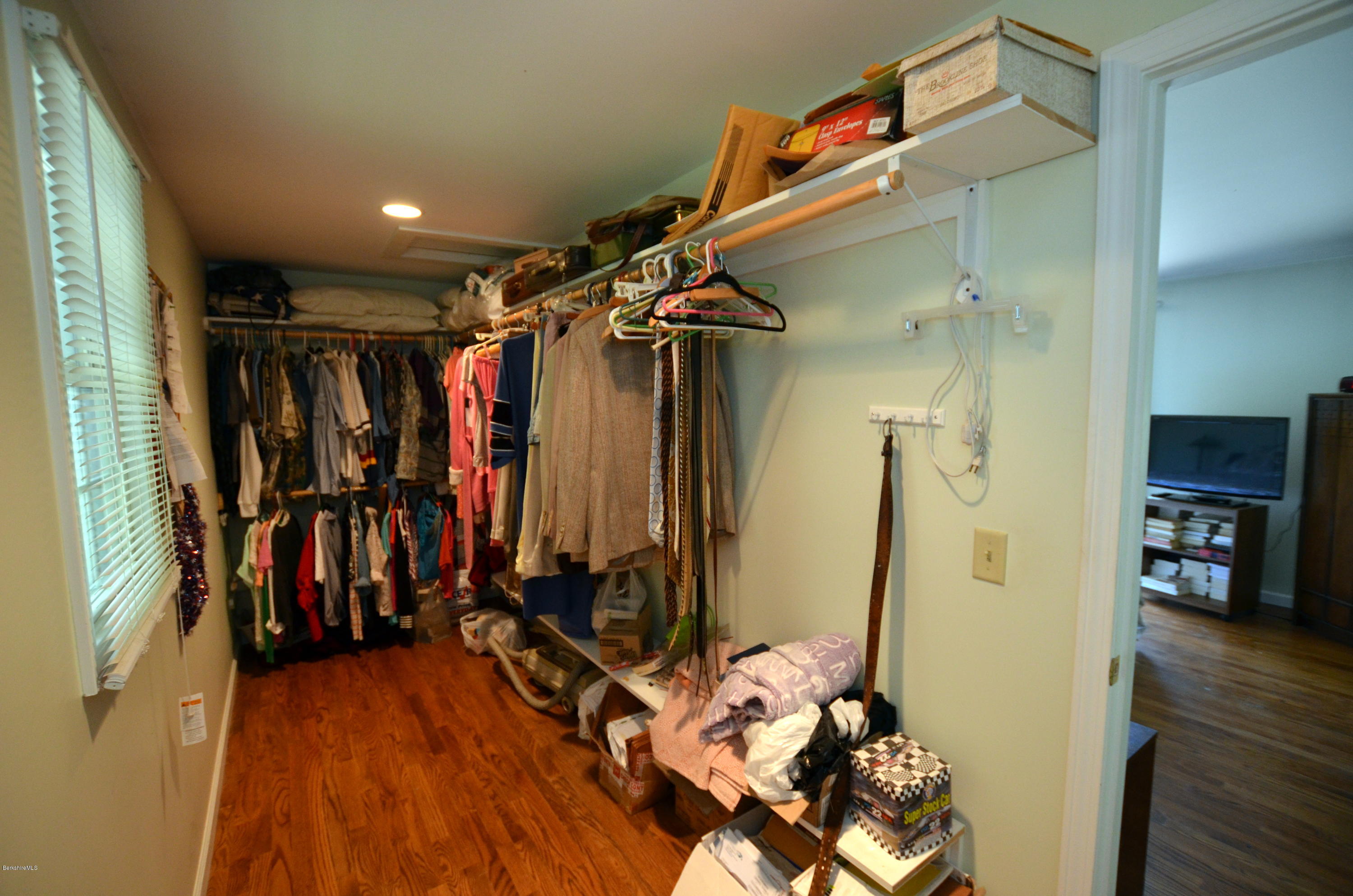 1381 East Otis Road Otis, MA 01029 - Photo 24 of 48 a view of walk in closet with clothes and shoes