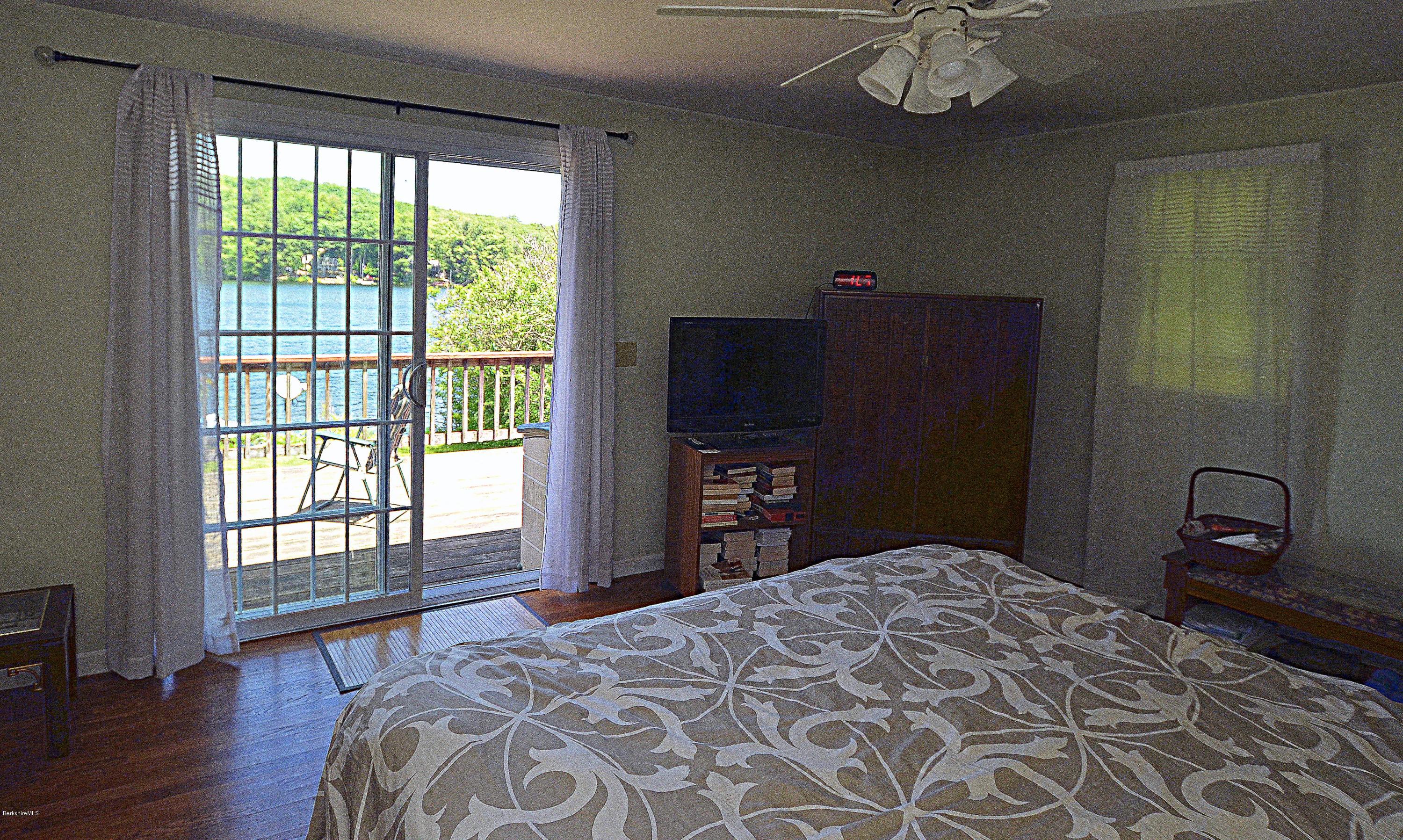 1381 East Otis Road Otis, MA 01029 - Photo 25 of 48 a bedroom with a bed and a television