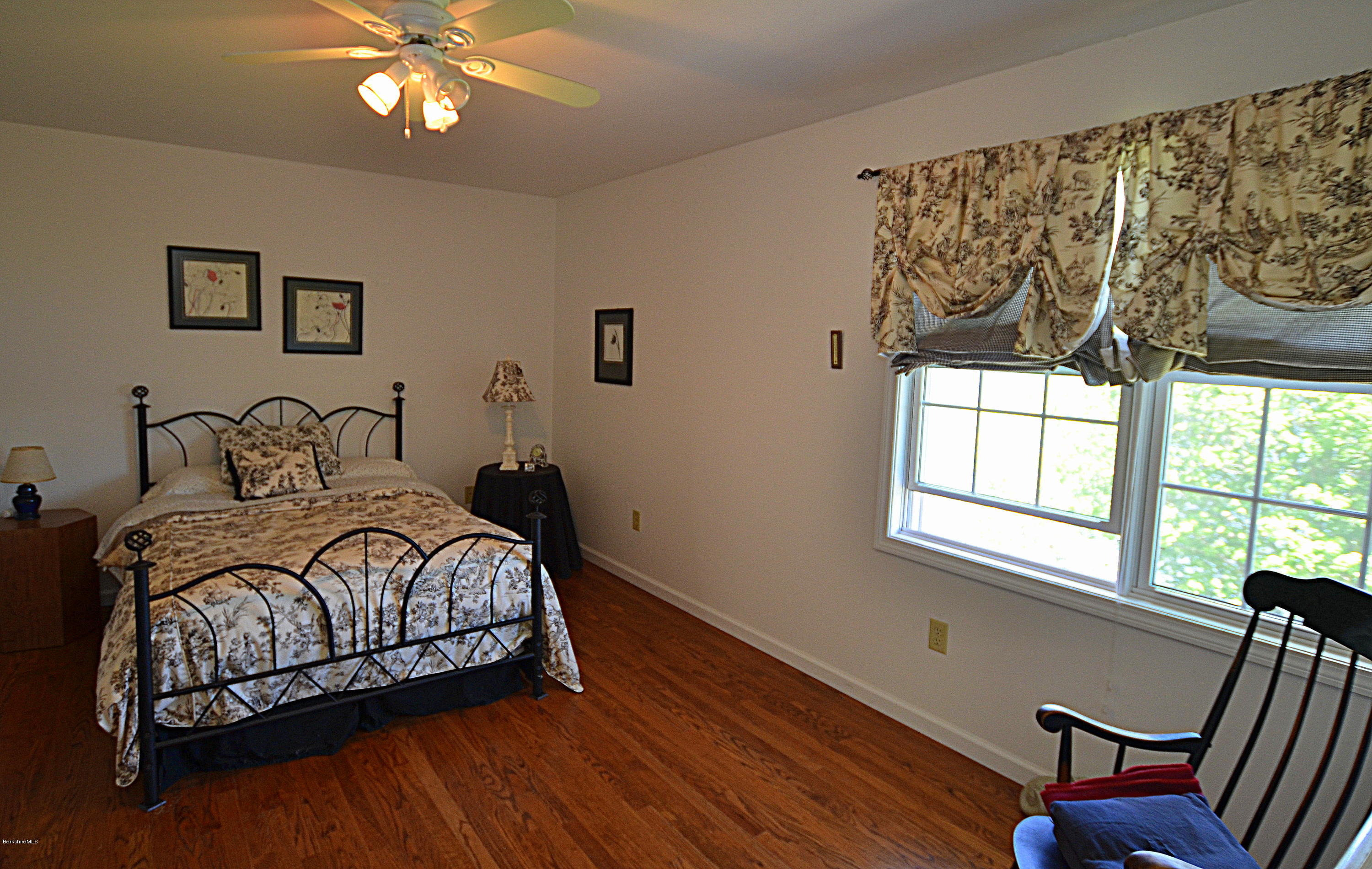 1381 East Otis Road Otis, MA 01029 - Photo 28 of 48 a bedroom with a bed and a window