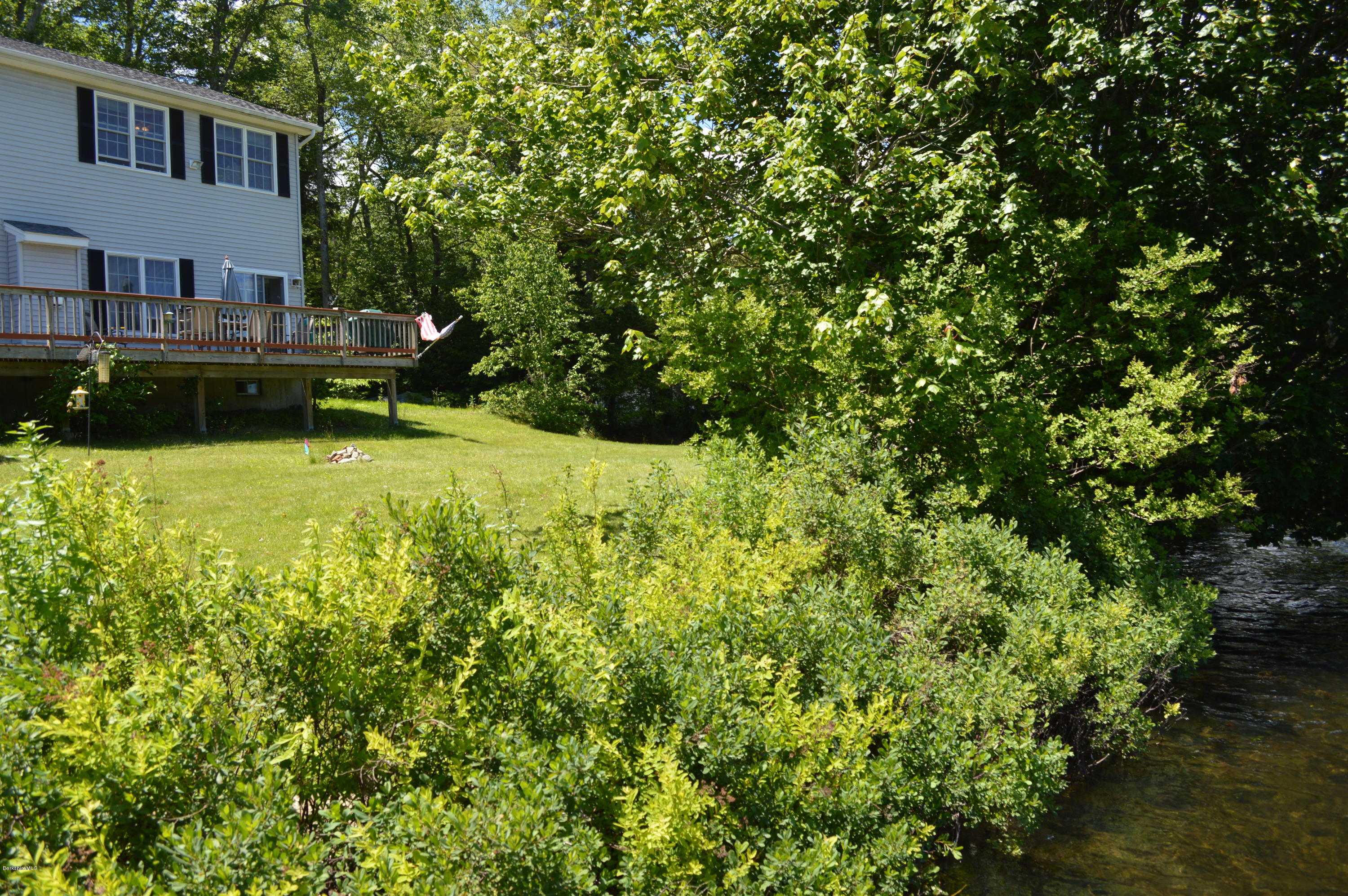 1381 East Otis Road Otis, MA 01029 - Photo 36 of 48 a view of backyard with swimming pool and seating space
