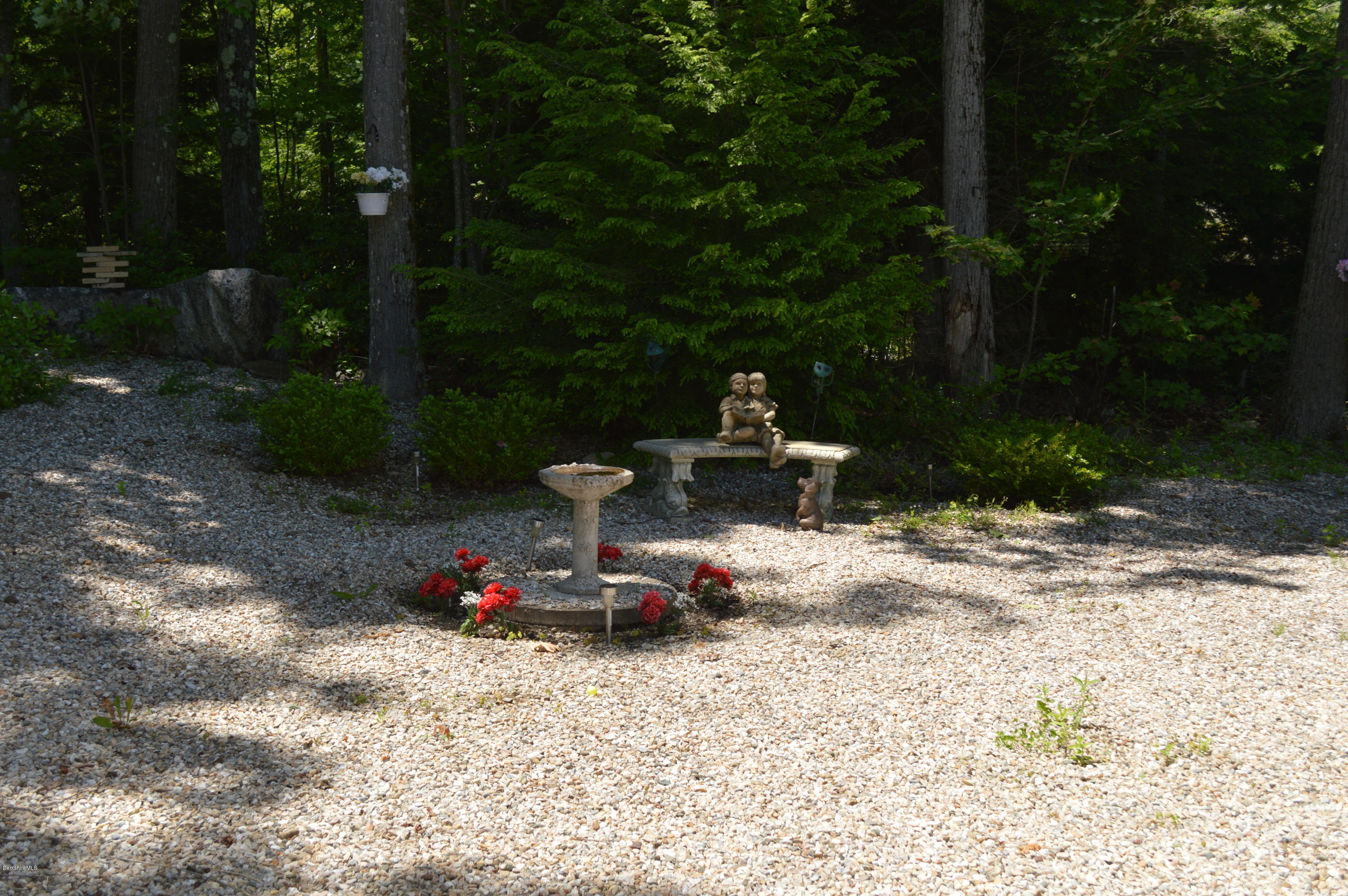 1381 East Otis Road Otis, MA 01029 - Photo 43 of 48 a view of a fire pit in front of a house