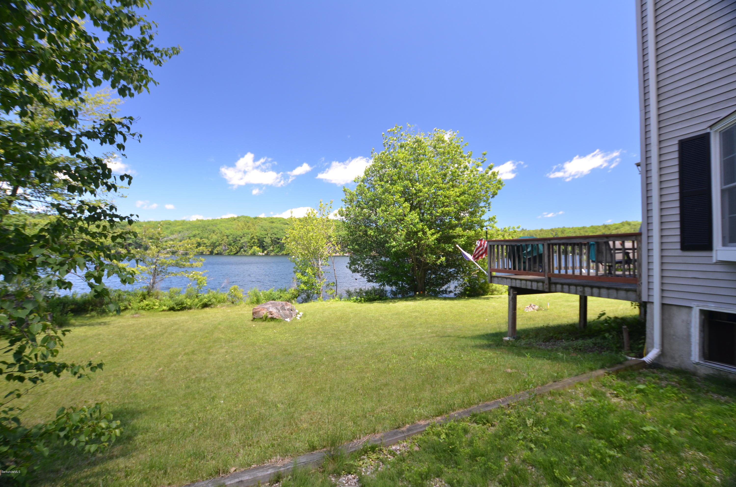 1381 East Otis Road Otis, MA 01029 - Photo 48 of 48 a view of a lake with a yard