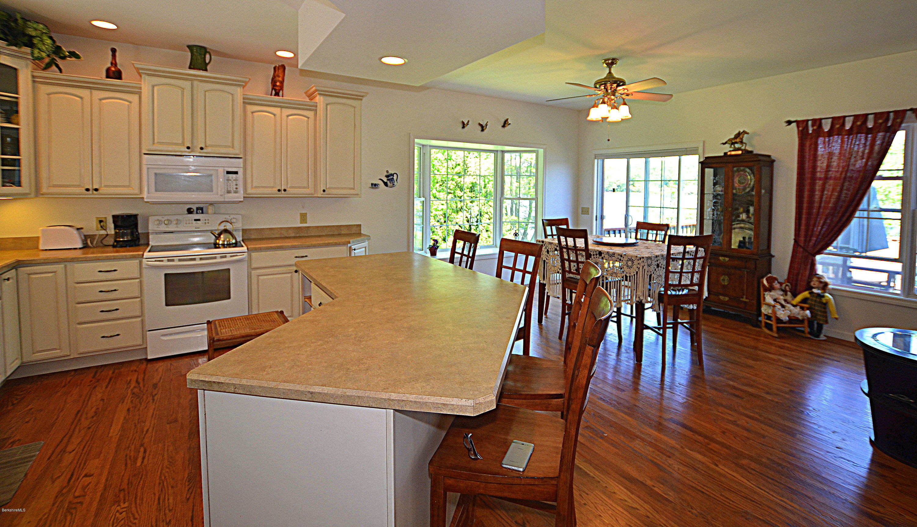 1381 East Otis Road Otis, MA 01029 - Photo 7 of 48 a view of a dining room with furniture and wooden floor