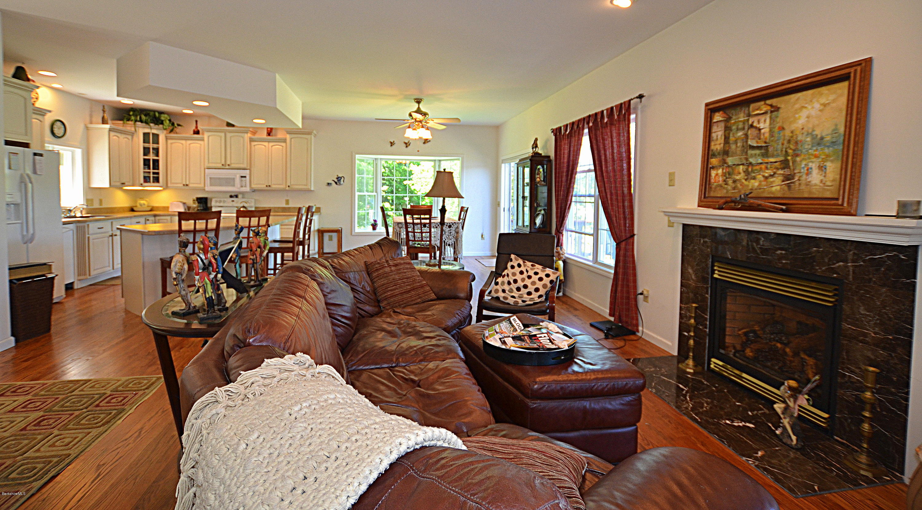 1381 East Otis Road Otis, MA 01029 - Photo 9 of 48 a living room with furniture and a fireplace