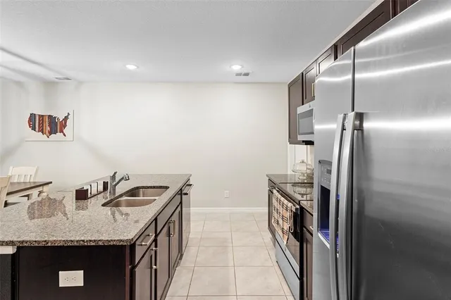 a kitchen that has a sink and a stove