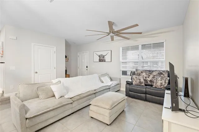 a living room with furniture and a large window