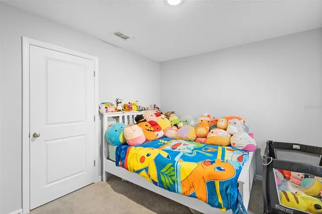 a bedroom with baby toys and stairs