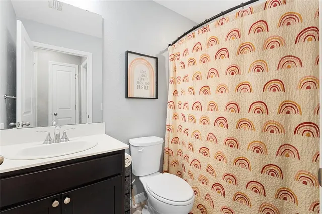 a bathroom with a toilet and a sink