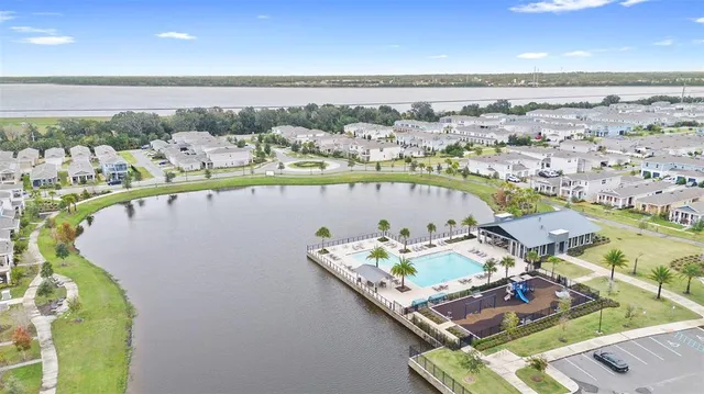 an aerial view of a house with a ocean view