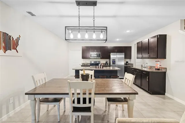 a kitchen with a counter space cabinets and stainless steel appliances