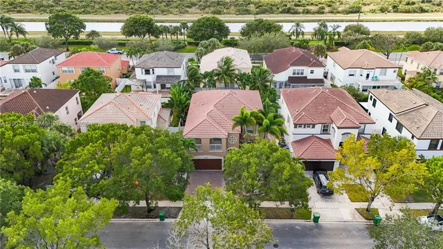 an aerial view of house with yard