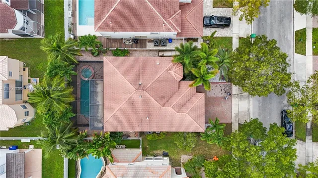 an aerial view of a house with a garden and plants