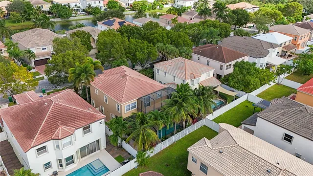 an aerial view of house with yard