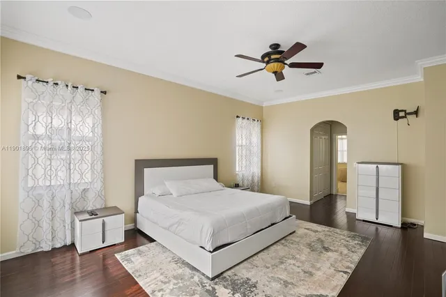 a bedroom with a large bed and a window