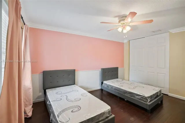 a bedroom with furniture and a window