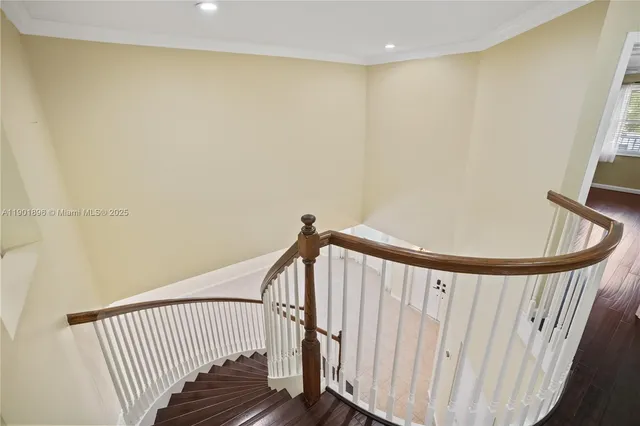 a balcony with view of palm tree