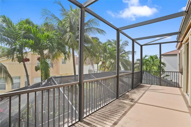 a view of a livingroom with wooden floor and stairs