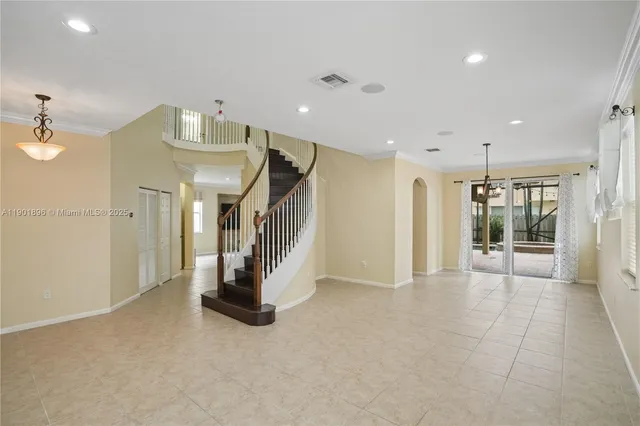 a view of a hallway with stairs