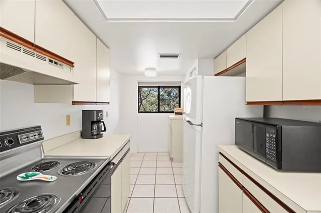 a kitchen with a stove and a refrigerator
