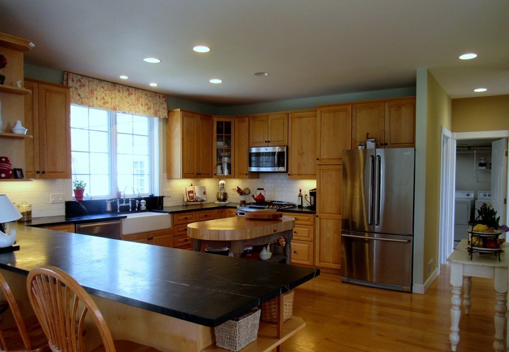 124 Turkey Hill Road Northampton, MA 01062 - Photo 13 of 30 a kitchen with granite countertop a stove refrigerator and microwave