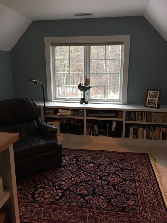 124 Turkey Hill Road Northampton, MA 01062 - Photo 20 of 30 a living room with a black white checkered floor with a rug