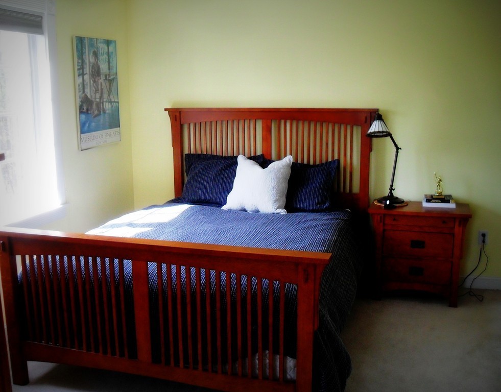 124 Turkey Hill Road Northampton, MA 01062 - Photo 21 of 30 a bed sitting in a bedroom next to a window