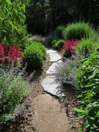 124 Turkey Hill Road Northampton, MA 01062 - Photo 4 of 30 a view of a pathway with a flower garden
