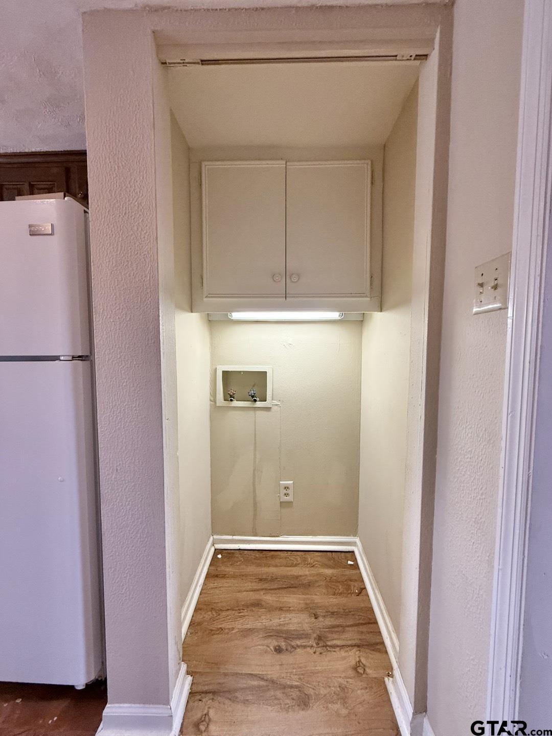 2510 Delmar Street Tyler, TX 75701 - Photo 11 of 18 a view of a hallway with wooden floor and cabinet
