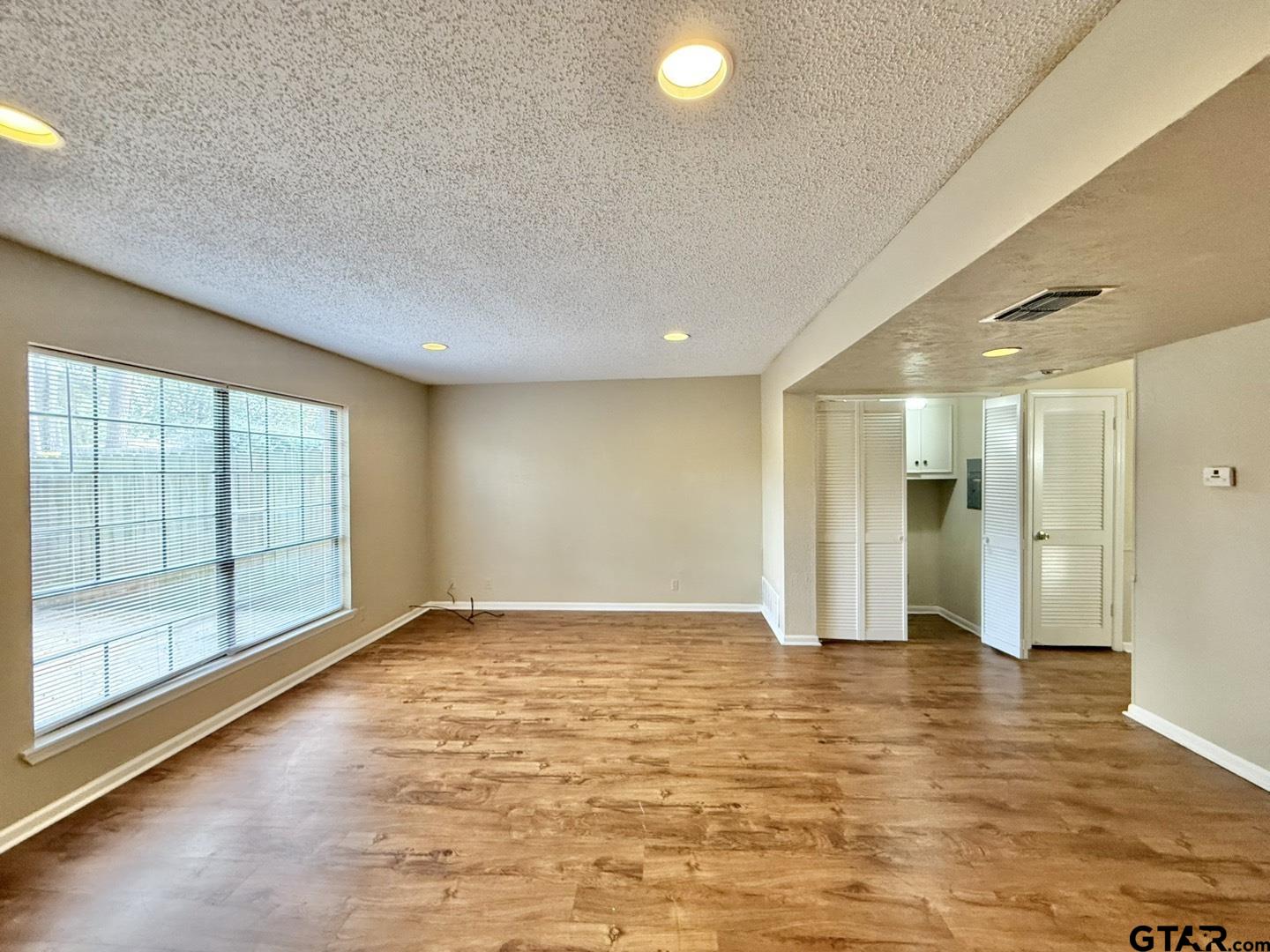 2510 Delmar Street Tyler, TX 75701 - Photo 12 of 18 a view of an empty room with glass door