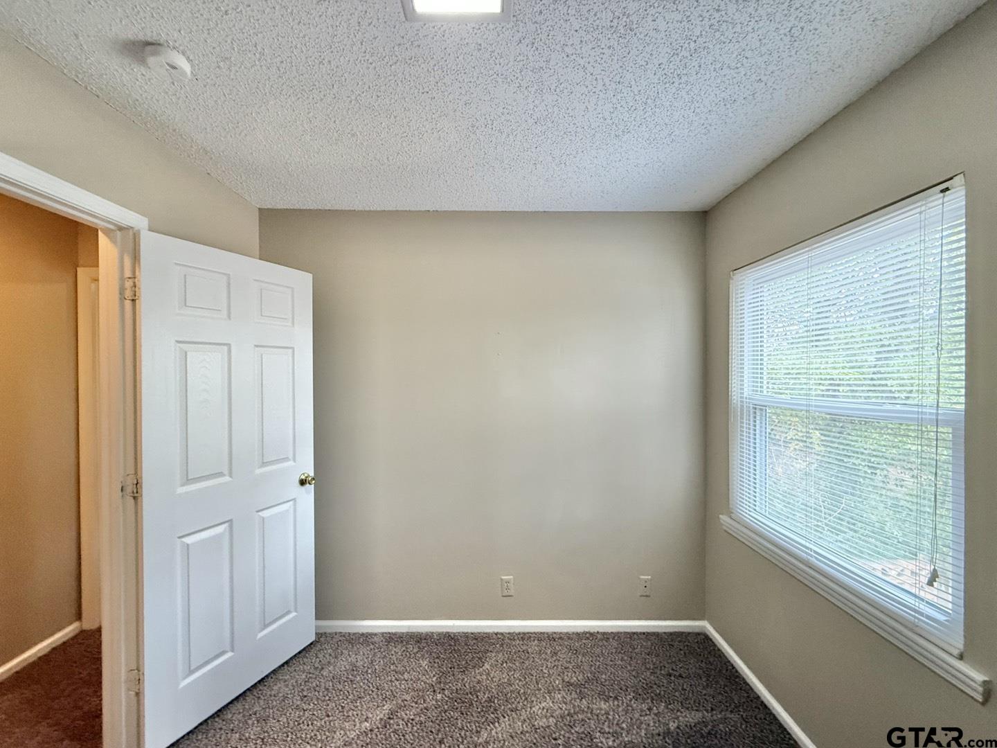 2510 Delmar Street Tyler, TX 75701 - Photo 14 of 18 an empty room with windows