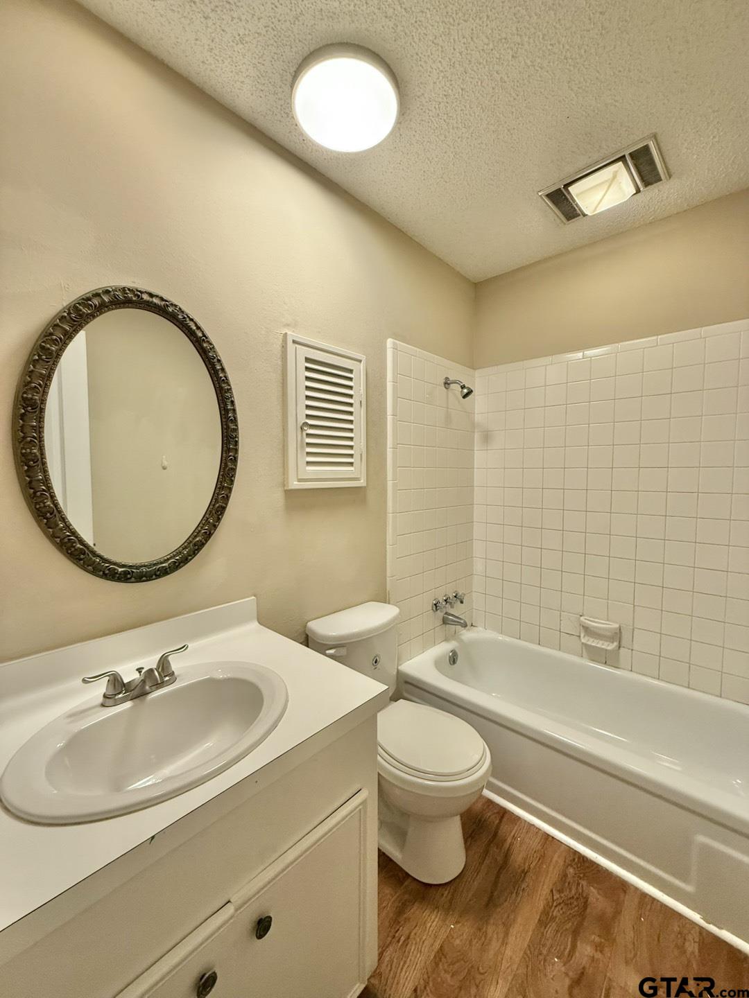 2510 Delmar Street Tyler, TX 75701 - Photo 17 of 18 a bathroom with a sink toilet and shower