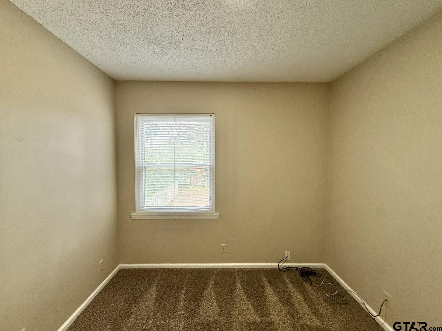 2510 Delmar Street Tyler, TX 75701 - Photo 6 of 18 an empty room with a window