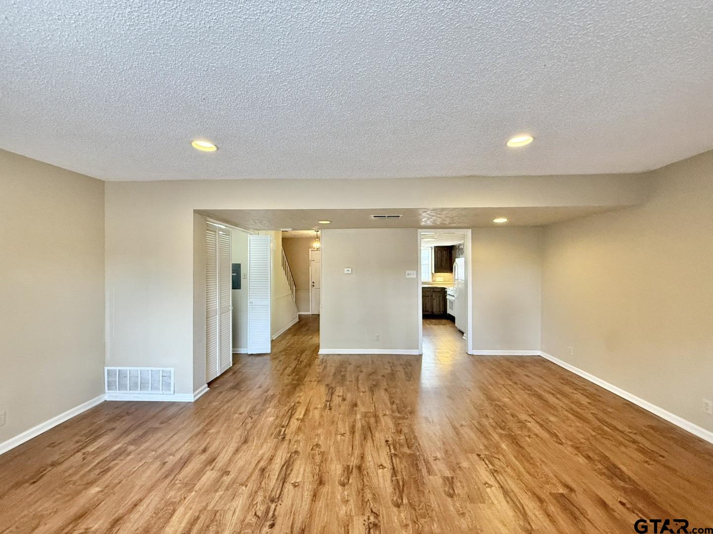 2510 Delmar Street Tyler, TX 75701 - Photo 9 of 18 a view of a room with wooden floor and stairs