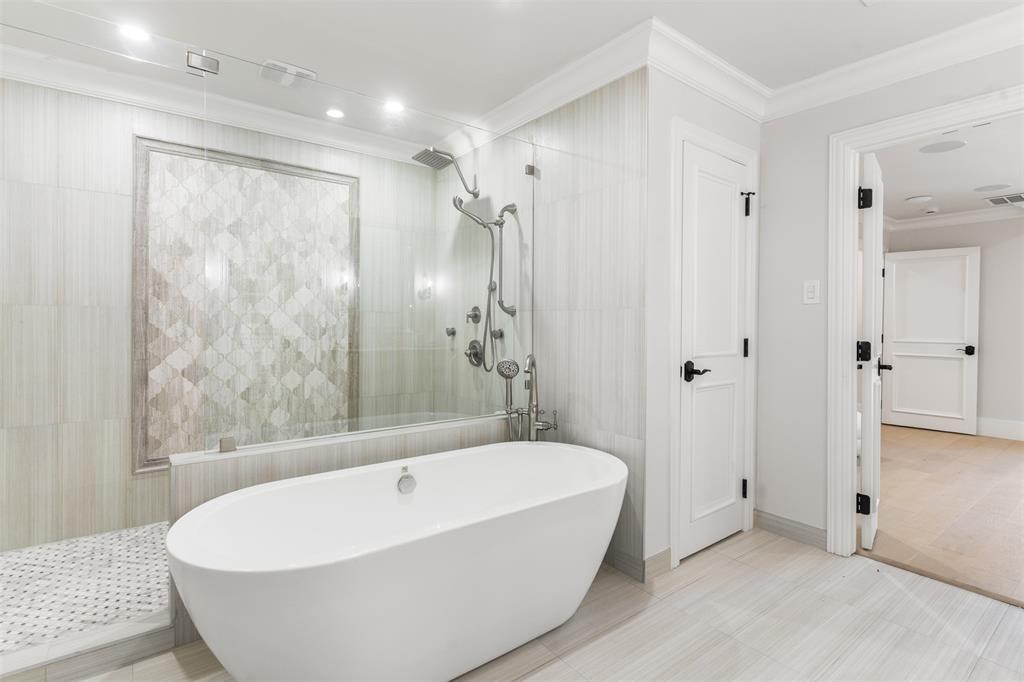 3922 Inwood Road Dallas, TX 75209 - Photo 17 of 35 a white bath tub sitting in a bathroom